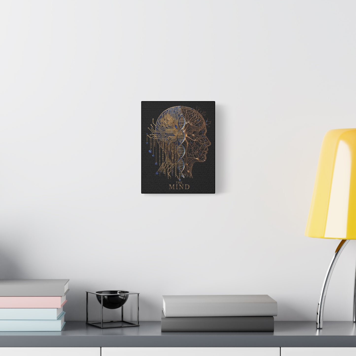 Canvas print of The Mind on a wall above a desk with books and a lamp.