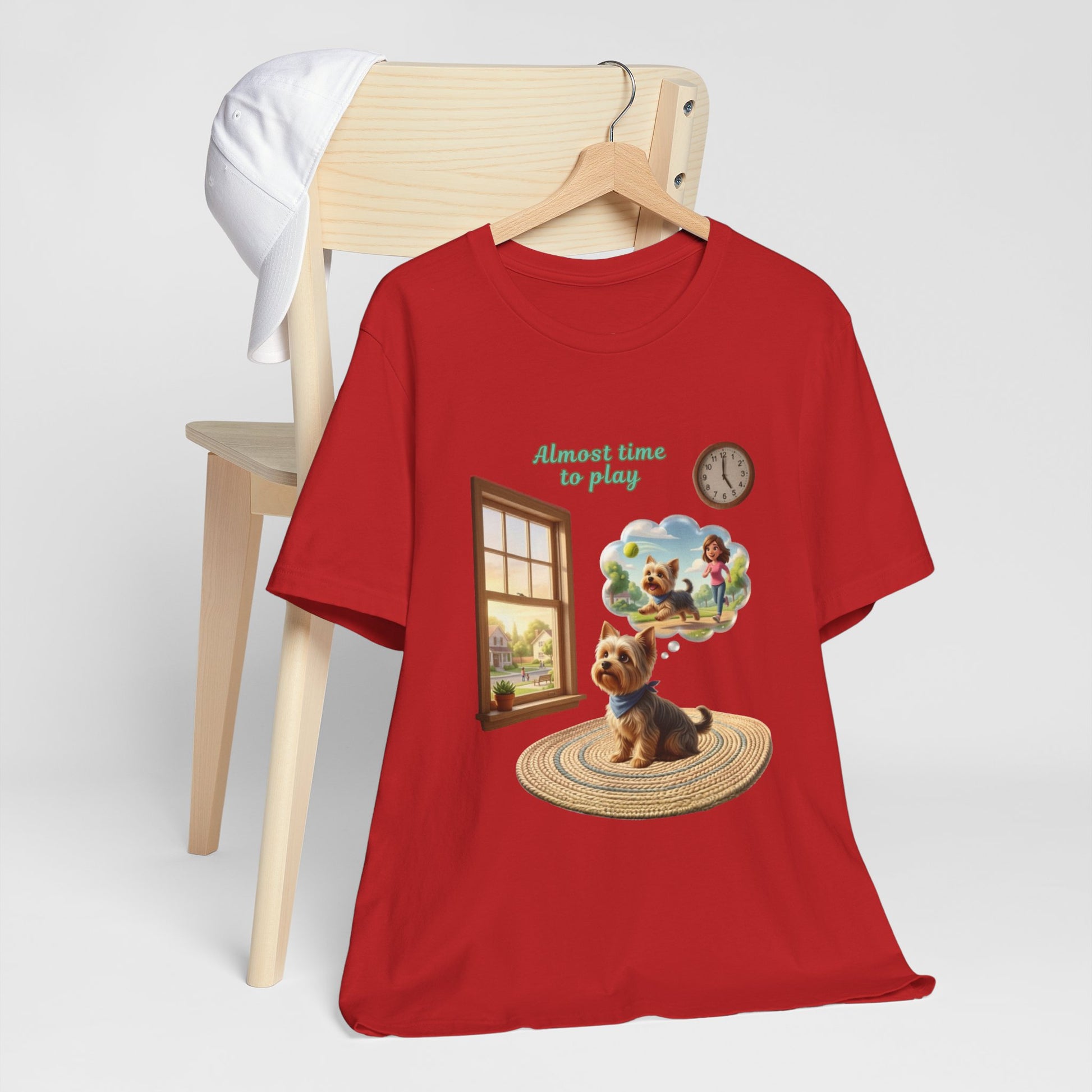 Red t-shirt with a dog graphic and text on a white background
